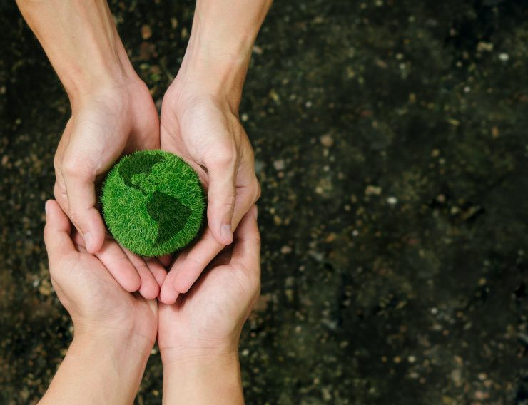 Net Zero and Carbon Neutral Concepts.Close up hands holding the earth to protect nature Save and care World for sustainable.Green Energy, ESG, Renewable. Environmental Care.